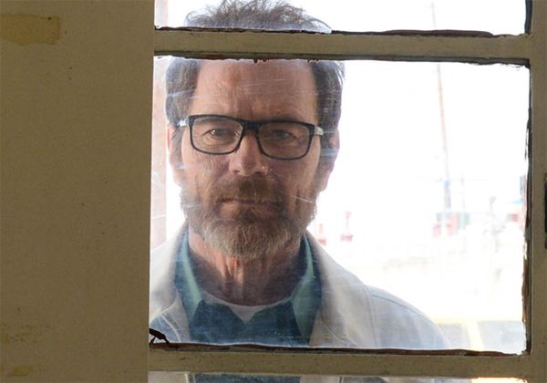 image of Walter White (Bryan Cranston) looking through a window