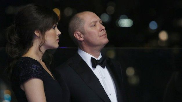 image of Agent Keen (Megan Boone) and Red Reddington (James Spader) standing and talking at a party in The Blacklist