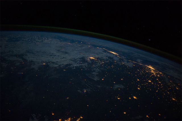 image of Brazil at night from the International Space Station, showing populated areas lit by electricity