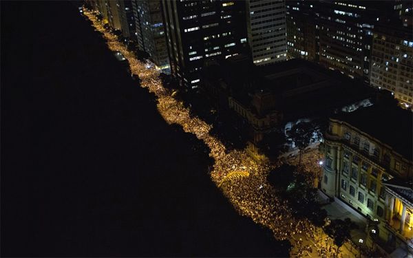 photo: nighttime view from above as people take to the streets in Rio