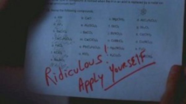 screen cap from an early episode of Breaking Bad showing one of Jesse Pinkman's tests on which Mr. White has written 'Ridiculous! Apply yourself!'