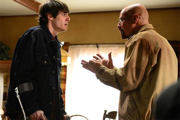 image of Walt Jr. (RJ Mitte) and Walt (Bryan Cranston) looking at each other; Junior looks horrified as Walt desperately tries to explain something to him