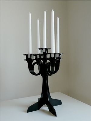 image of a modern black candelabra with white candles