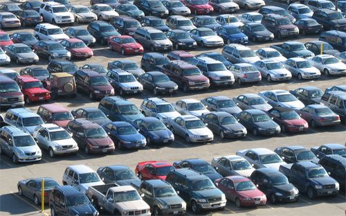 image of a large parking lot full of parked cars