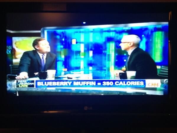 image of CNN broadcast last night, while Piers Morgan and Dr. Drew talk during a segment labeled onscreen as 'BLUEBERRY MUFFIN = 350 CALORIES'