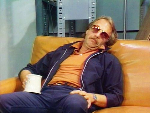 image of WKRP character Dr. Johnny Fever passed out on a couch