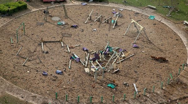 image of a destroyed playground across the street from the plant
