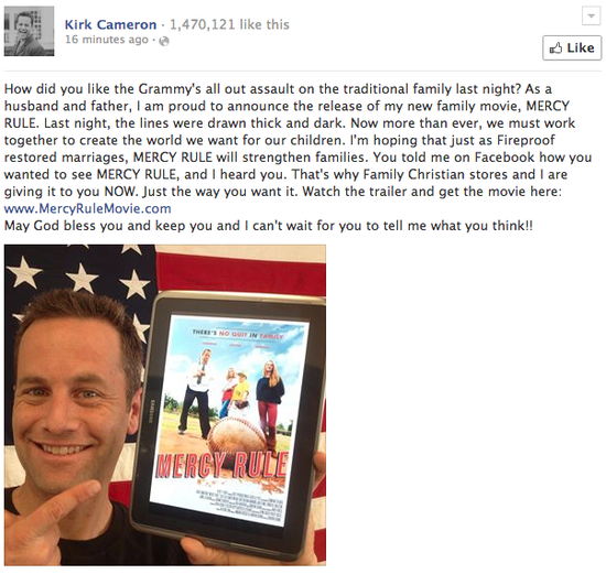 screencap of Kirk Cameron's Facebook status asking 'How did you like the Grammy's all out assault on traditional families last night?' then segueing into a pitch for his film, followed by an image of him standing in front of a US flag holding a tablet on which appears an image of the movie poster