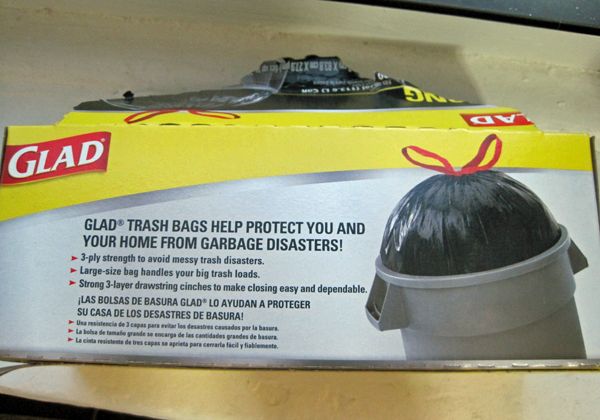 photo of a box of trash bags reading: 'GLAD Trash Bags help protect you and your home from garbage disasters.'