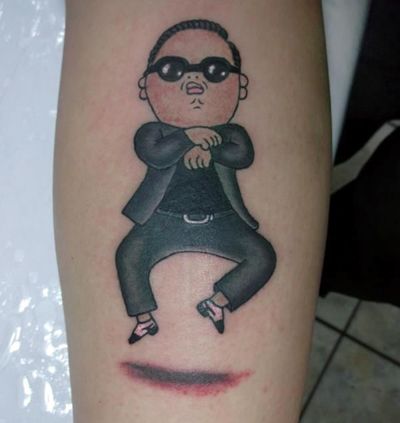 image of a tattoo of Gangnam Style singer Psy on someone's calf