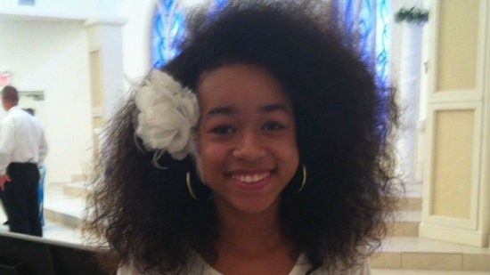 image of a thin, pretty, black teenage girl with shoulder-length natural hair