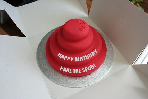 image of a birthday cake shaped like a Devo Energy Dome, to which I've added text reading HAPPY BIRTHDAY PAUL THE SPUD!