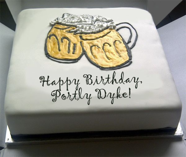 image of a cake with two frosting beer mugs toasting, reading 'Happy Birthday, Portly Dyke!'