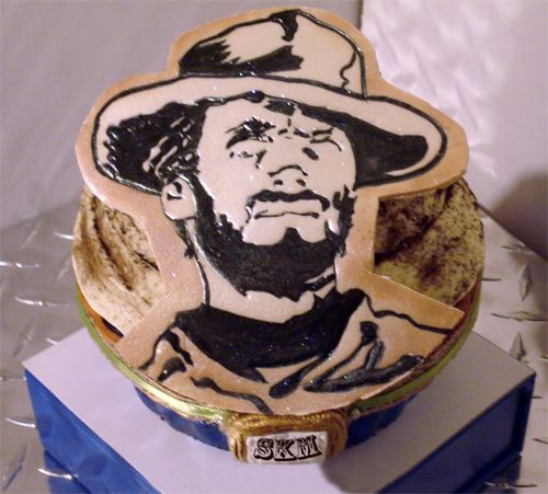 image of a birthday cake with an image of Clint Eastwood on it