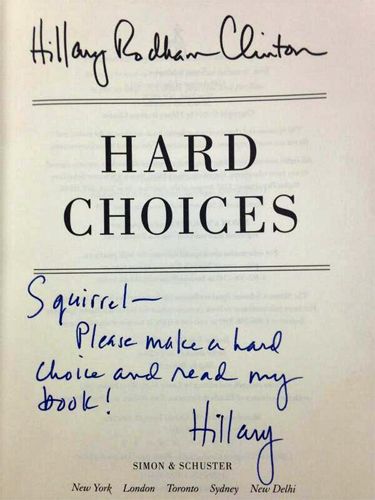 image of the front page of the memoir 'Hard Choices' with a handwritten inscription reading: 'Squirrel—Please make a hard choice and read my book! Hillary'