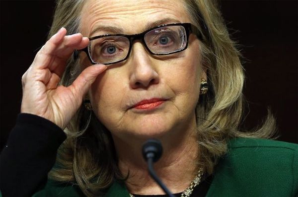 image of Clinton looking pissy and adjusting her glasses