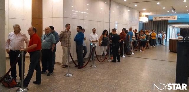 image of a long line of people standing in line, waiting to be married