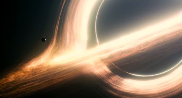 image of a small planet outside a massive black hole, from the film Interstellar