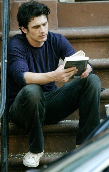 image of James Franco sitting on a stoop, reading