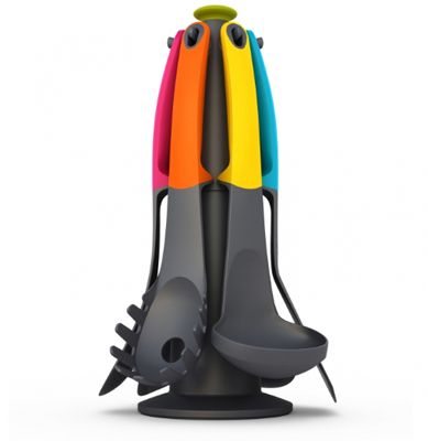 image of a grey holder with colorful kitchen utensils hanging on it