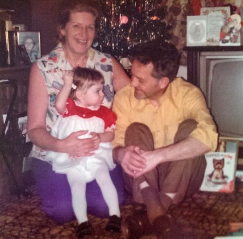 image of me as a baby sitting on my grandmother's lap; my grandfather sits beside us, and he and I are looking at one another