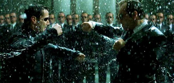 image of Keanu Reeve as Neo in The Matrix Revolutions fighting Hugo Weaving as Agent Smith, with a million Agent Smiths in the background