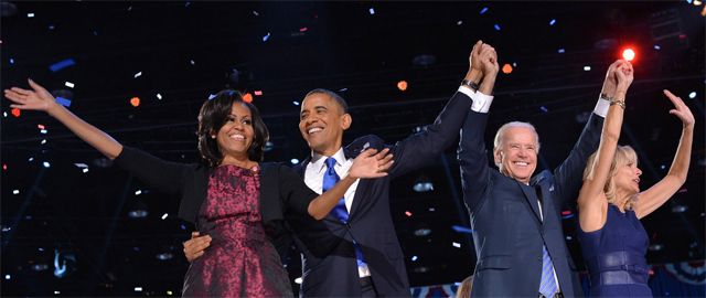 image of First Lady Michelle Obama, President Barack Obama, Vice President Joe Biden, and Dr. Jill Biden onstage at the Team Obama victory rally last night, raising their arms in celebration as red, white, and blue confetti falls around them