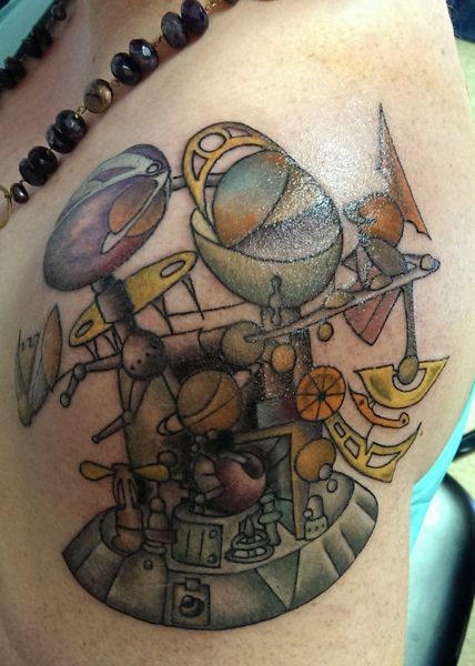 image of a tattoo on my left shoulder inspired by Aughra's orrery from The Dark Crystal