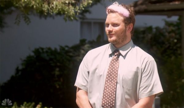 image of Andy (Chris Pratt) wearing a fairy princess tiara and making a knowing face