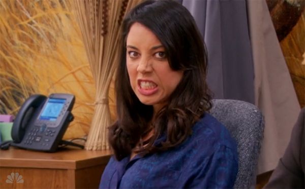 image of April (Aubrey Plaza) bearing her teeth