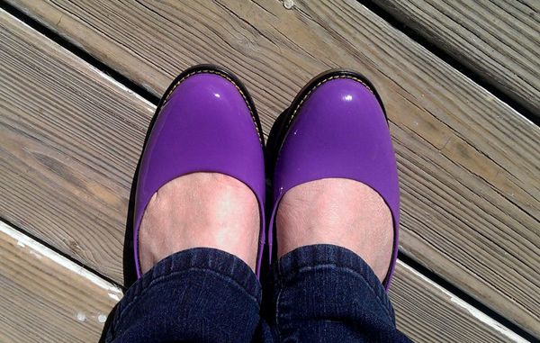 image of my feet in purple slip-on Doc Marten shoes, below the cuffs of dark blue jeans
