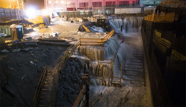 image of water rushing into the site at Ground Zero in New York City
