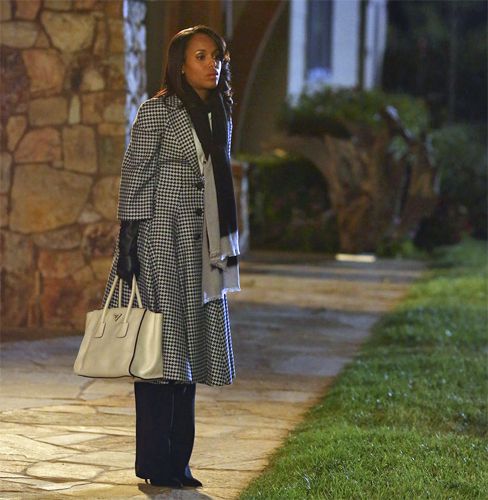 image of Olivia Pope (Kerry Washington) standing in place with a sick look on her face