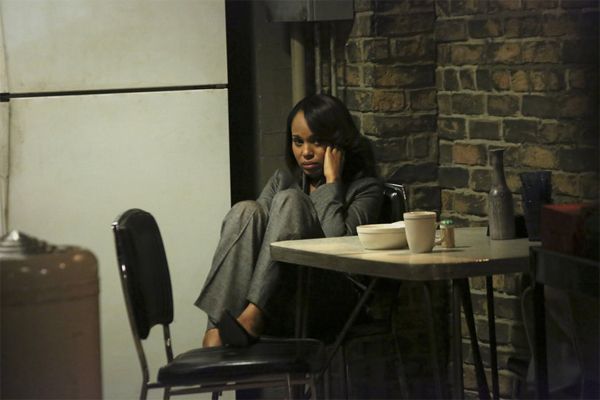 image of Olivia (Kerry Washington) huddled in a corner, looking frightened, anxious, horrified