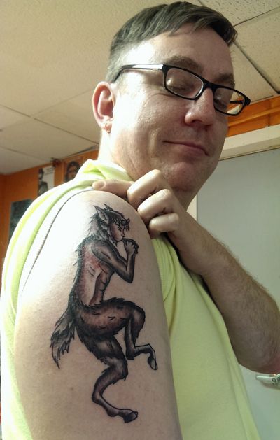 image of Deeky showing off his new tattoo