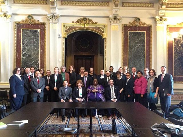 image of more than two dozen transgender and allied activists posing for a group photo at the White House yesterday