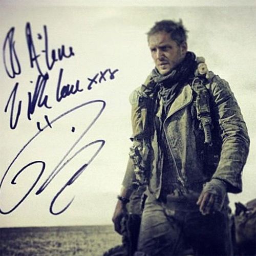 an Instagram photo of Tom Hardy in Mad Max costume, which has been signed