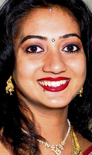 image of Savita Halappanavar, an Indian woman in her 30s, in which she is smiling broadly