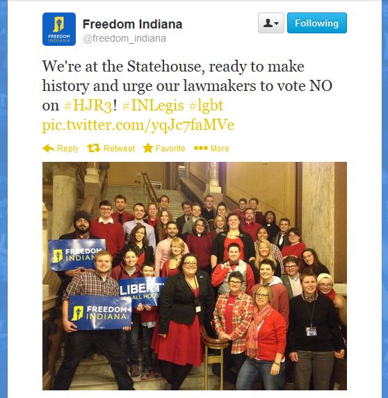 screen cap of tweet by Freedom Indiana featuring a photo of people preparing to protest at the State House and text reading: 'We're at the Statehouse, ready to make history and urge our lawmakers to vote NO on HJR3!'