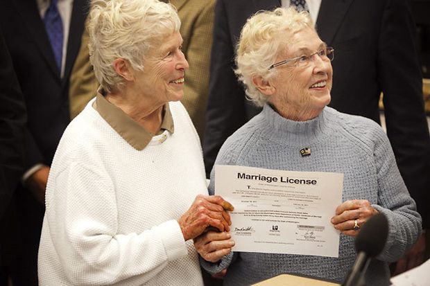 image of two elderly white women holding up their marriage license