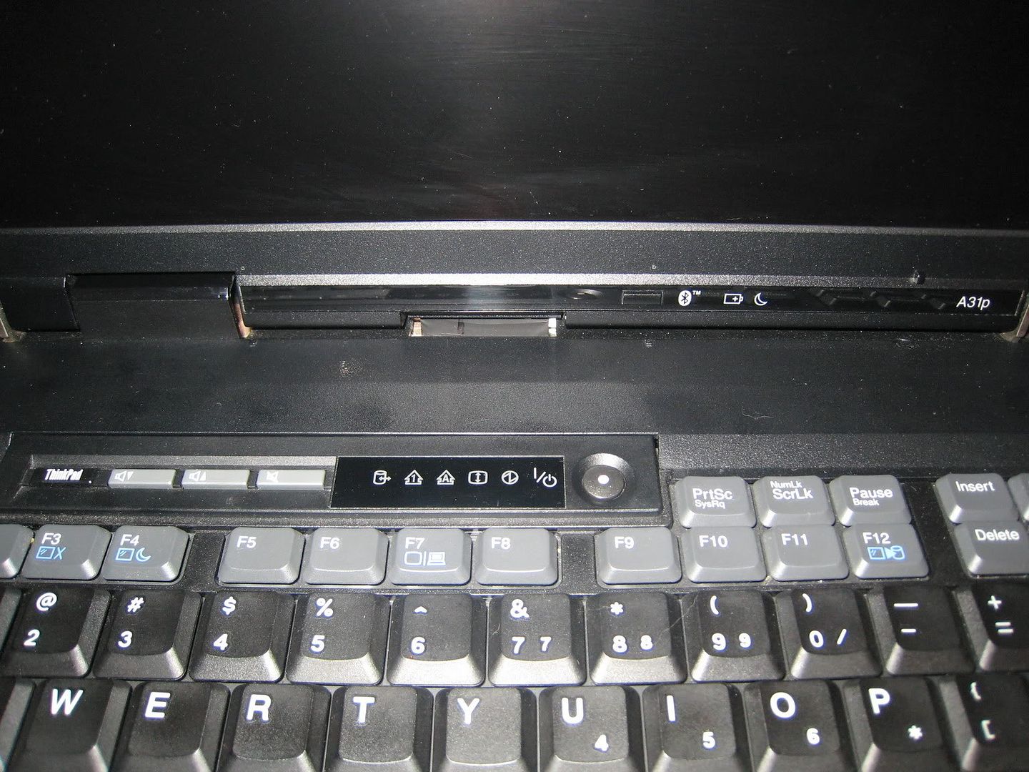 The strip containing the power button, most of the LED indicators (future generations will move them to the clearplate), volume and Thinkpad buttons.