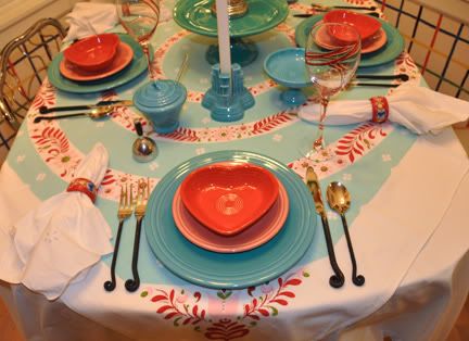 Place settings are turquoise rose and scarlet Post86 Fiesta