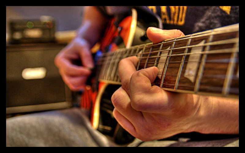 IMAGE: http://img.photobucket.com/albums/v67/rparchen/Photography/PlayingGuitar.jpg
