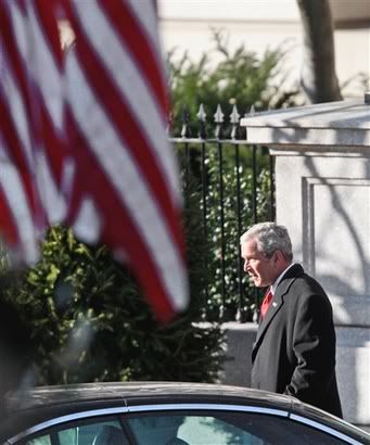President George W. Bush walks back to the White House in Washington, Wednesday, Jan. 14, 2009, after saying good-bye to Eisenhower Executive Office Building staff, and having farewell pictures taken with them Pictures, Images and Photos
