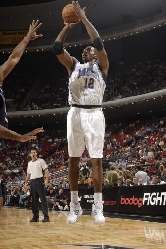Dwight Howard rises for a jump-shot in a preseason NBA basketball game between the Orlando Magic and the Atlanta Hawks