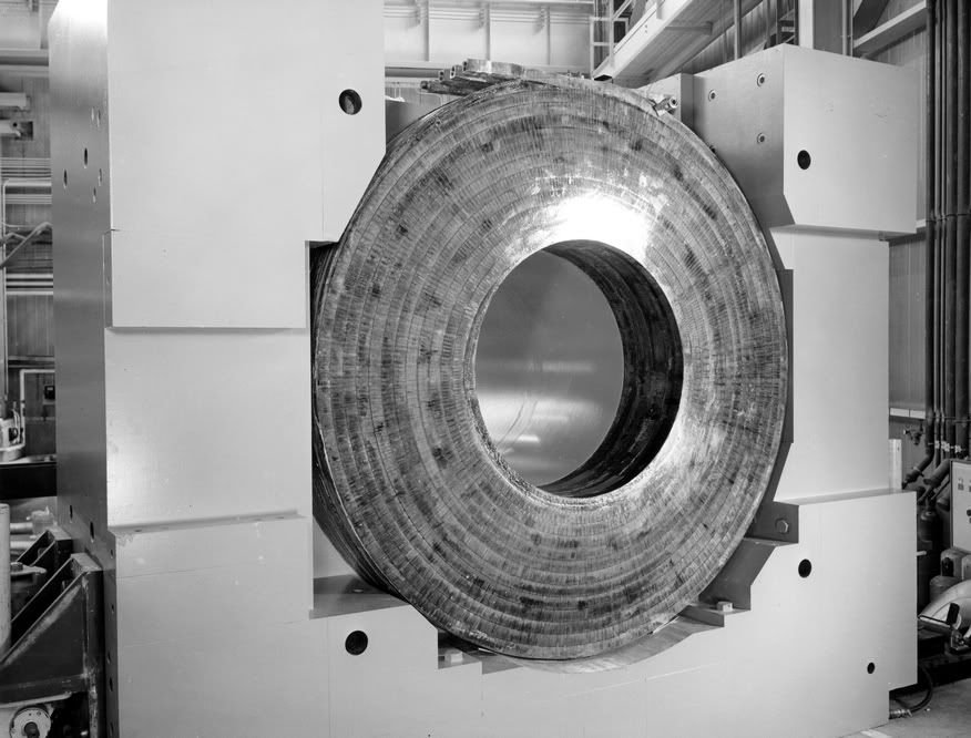 The enormous coil and magnet yoke that would encase a 30-inch hydrogen bubble chamber. (Archival Photographic Files, apf digital item number apf2-00491, Special Collections Research Center, University of Chicago Library) The enormous coil and magnet yoke that would encase a 30-inch hydrogen bubble chamber. (Archival Photographic Files, apf digital item number apf2-00491, Special Collections Research Center, University of Chicago Library)