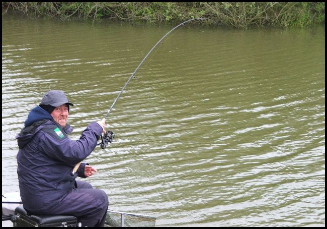 Paul playing a carp