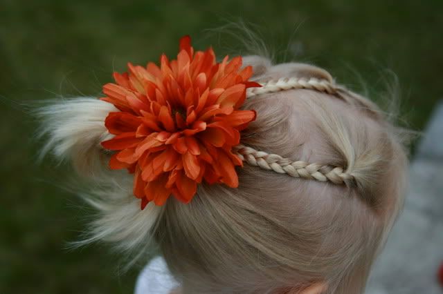 Same hairstyle on both girls - several ponytails pulled together (I call it 