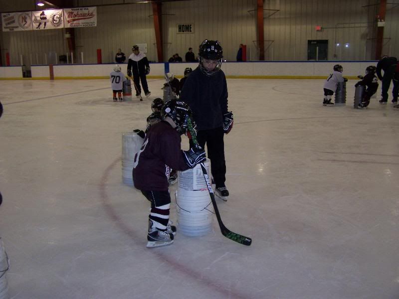 Yes, those are buckets from Lowe's. And yes, that's the coach's son!