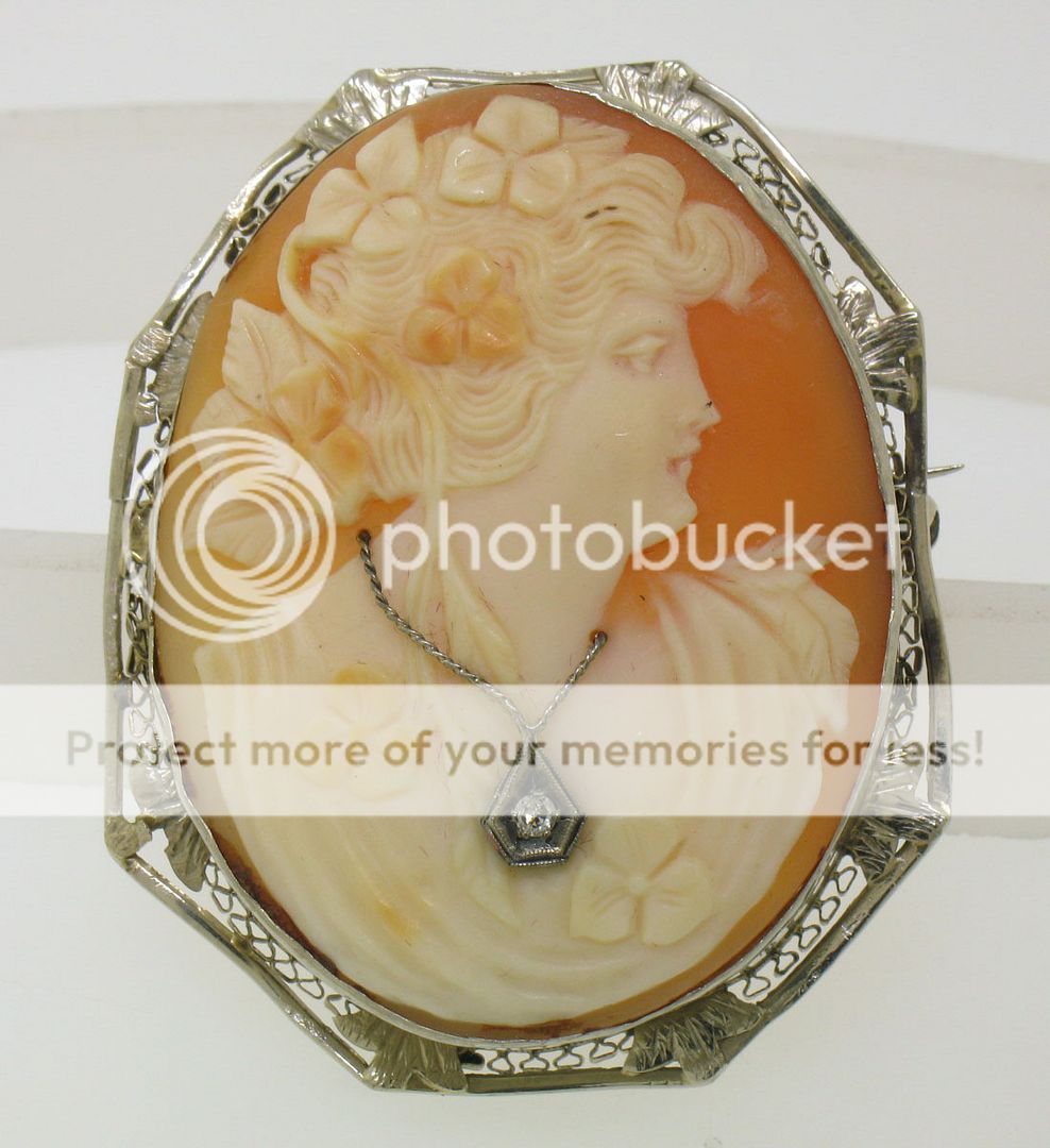 Cameo measures 1.75 by 1.35 inches. Frame measures 1.90 by 1.50 inches 